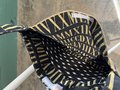 He him crossbody bag gold and black 