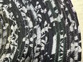 Black white oval rug with rainbow thread