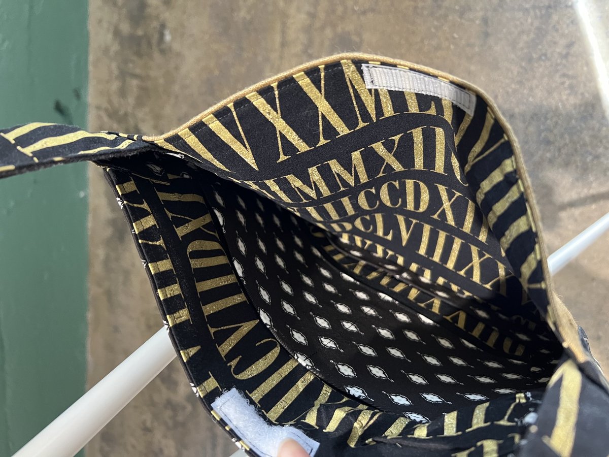 He him crossbody bag gold and black 