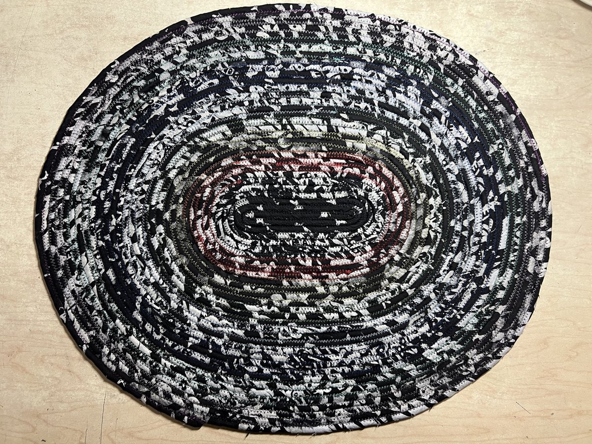 Black white oval rug with rainbow thread
