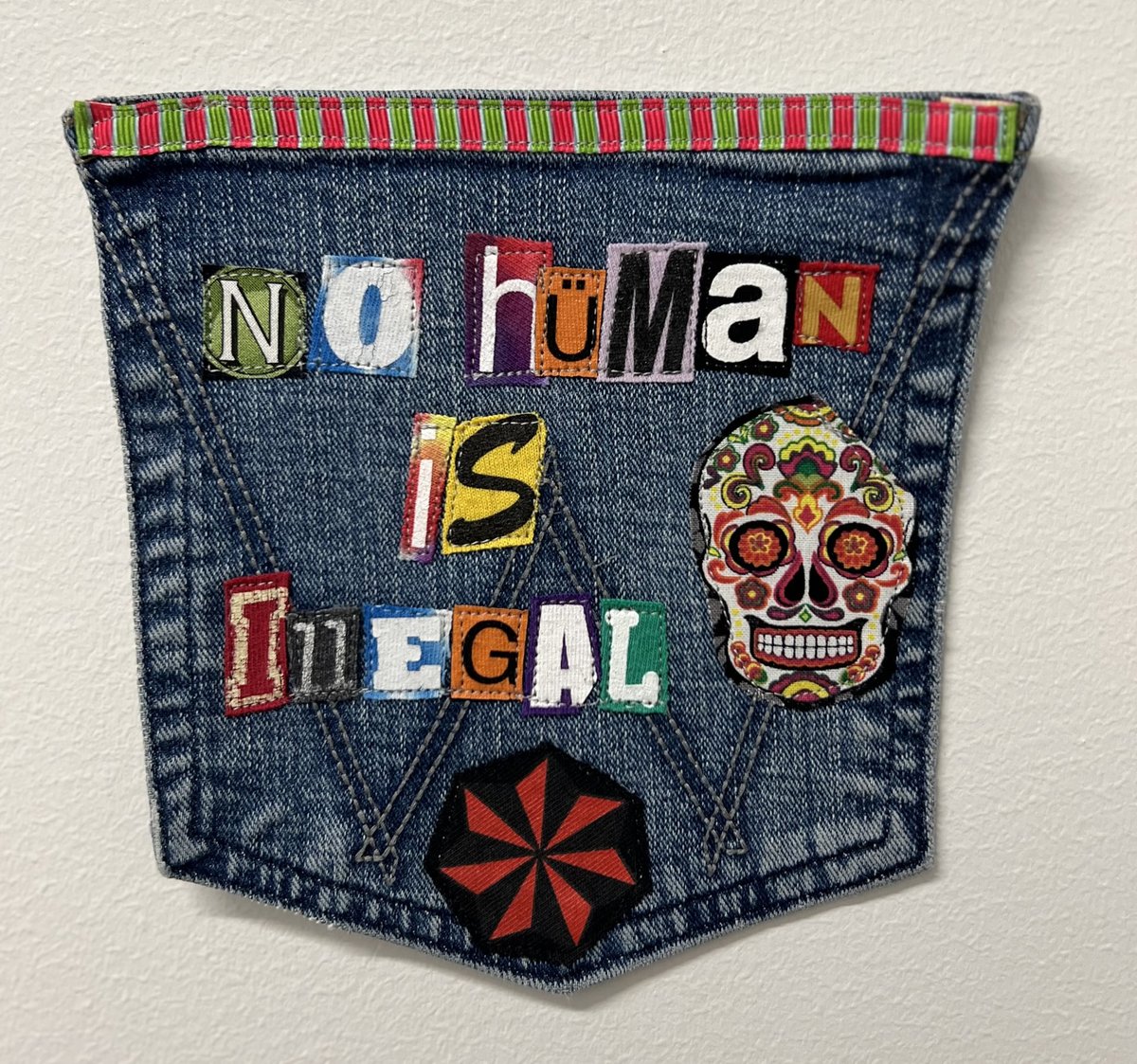 No human is illegal art collage patch