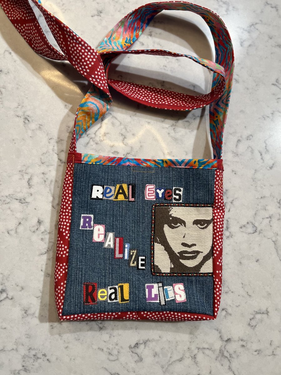 Real Eyes crossbody bag