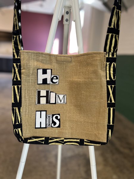 He him crossbody bag gold and black 