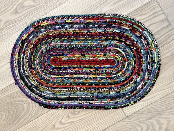Black and bright scrap rope rug or table topper
